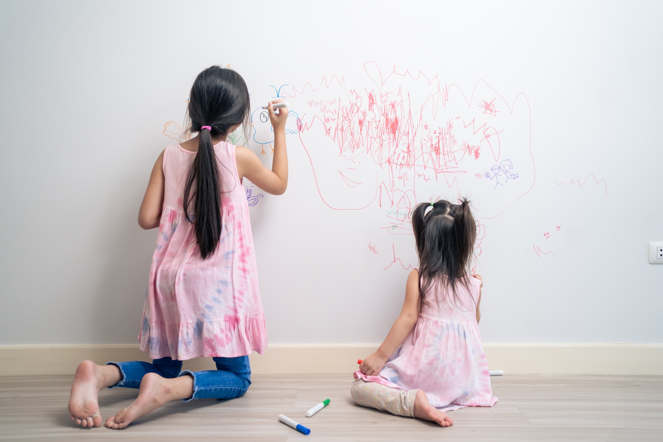 kids drawing on the wall